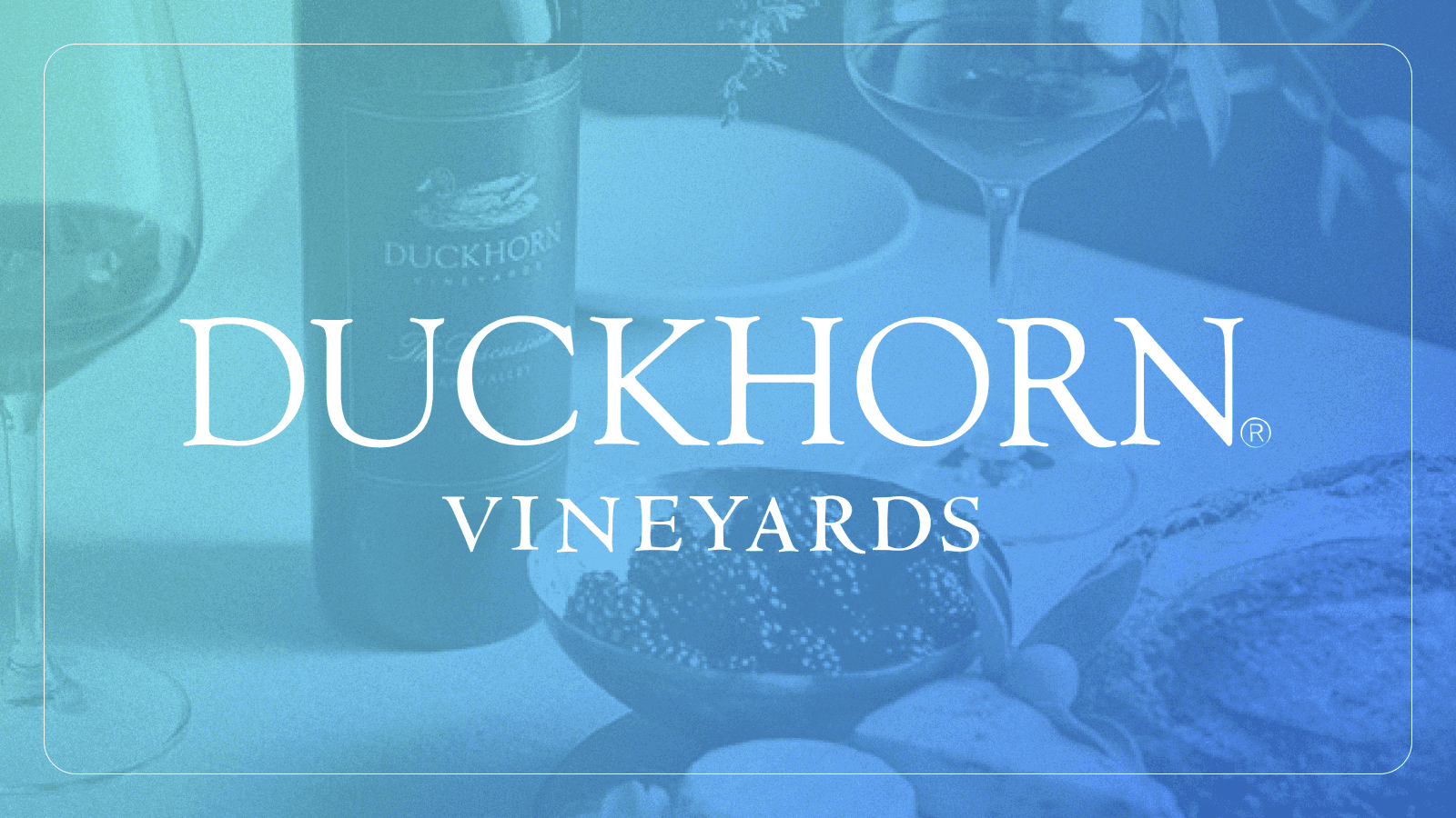 Duckhorn Vineyards logo over a background image of grapevines and grapes.