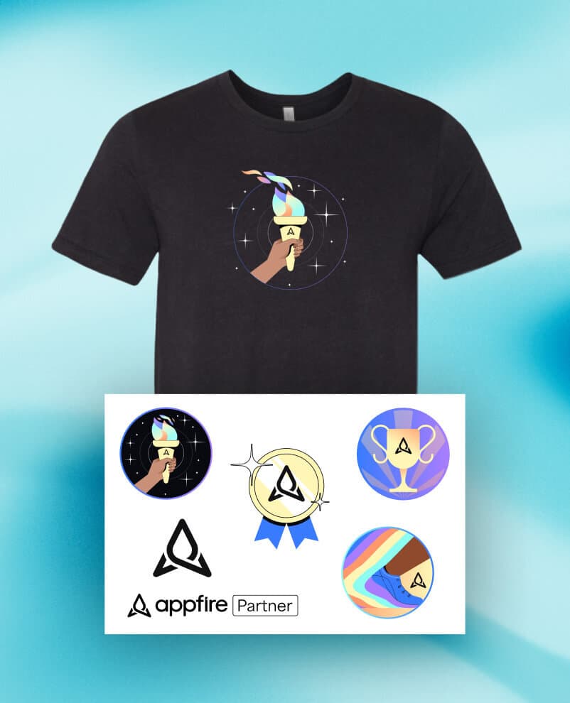 Image of Appfire branded merchandise including a t-shirt with a space theme and a sheet of stickers with various logos and designs