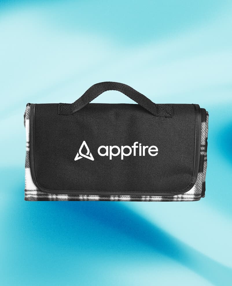 Image of an Appfire branded blanket, folded and featuring the Appfire logo.